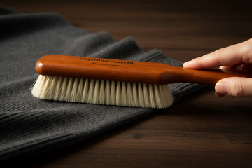 fine_goat_hair_lint_garment_cleaning_brush_pear_wood_editorial.png